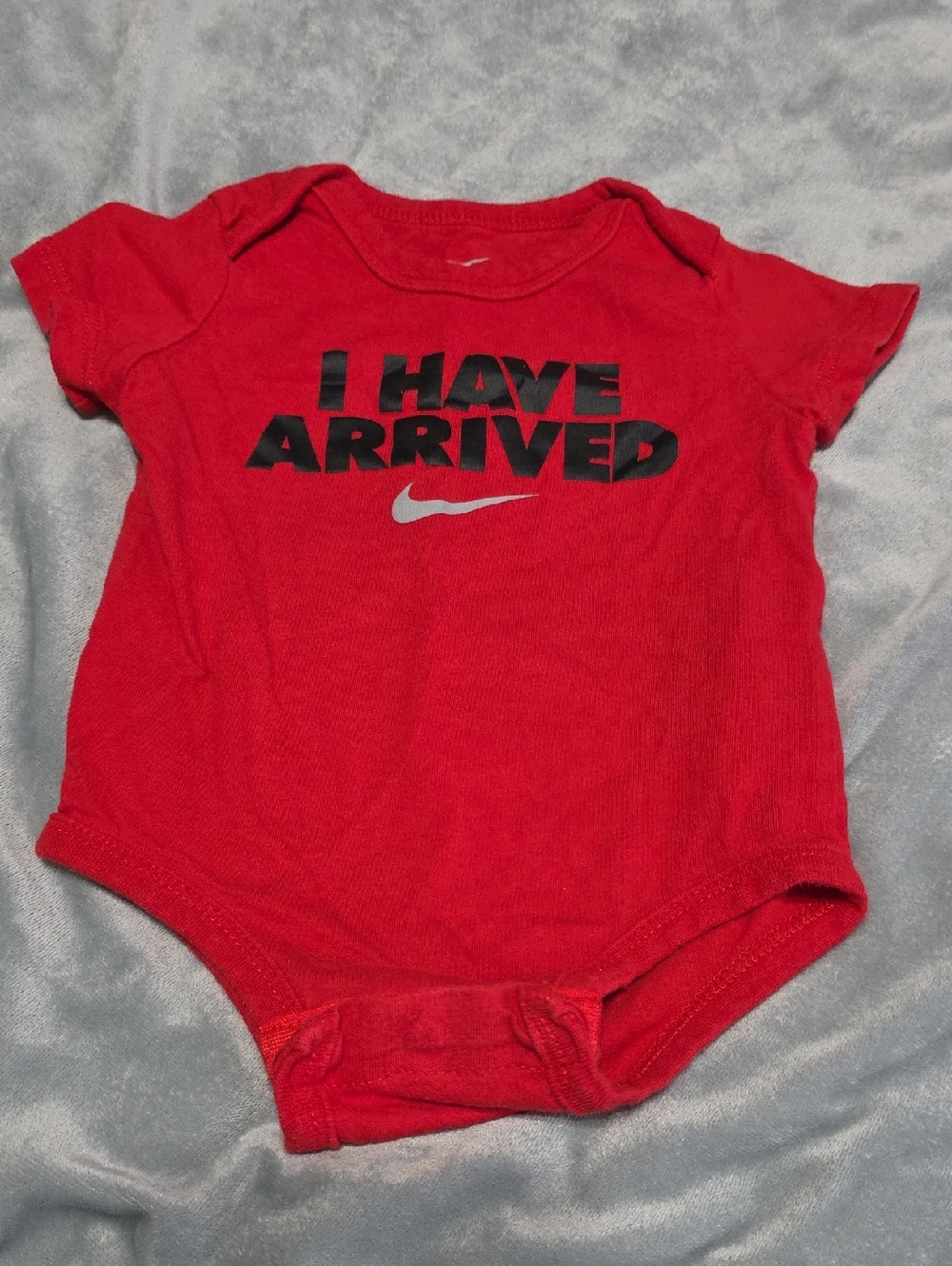Nike Red Baby Onesie with Black Text and Silver Swoosh